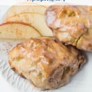 Two apple fritters on a plate, text overlay reads "air fryer apple fritters, rachelcooks.com"