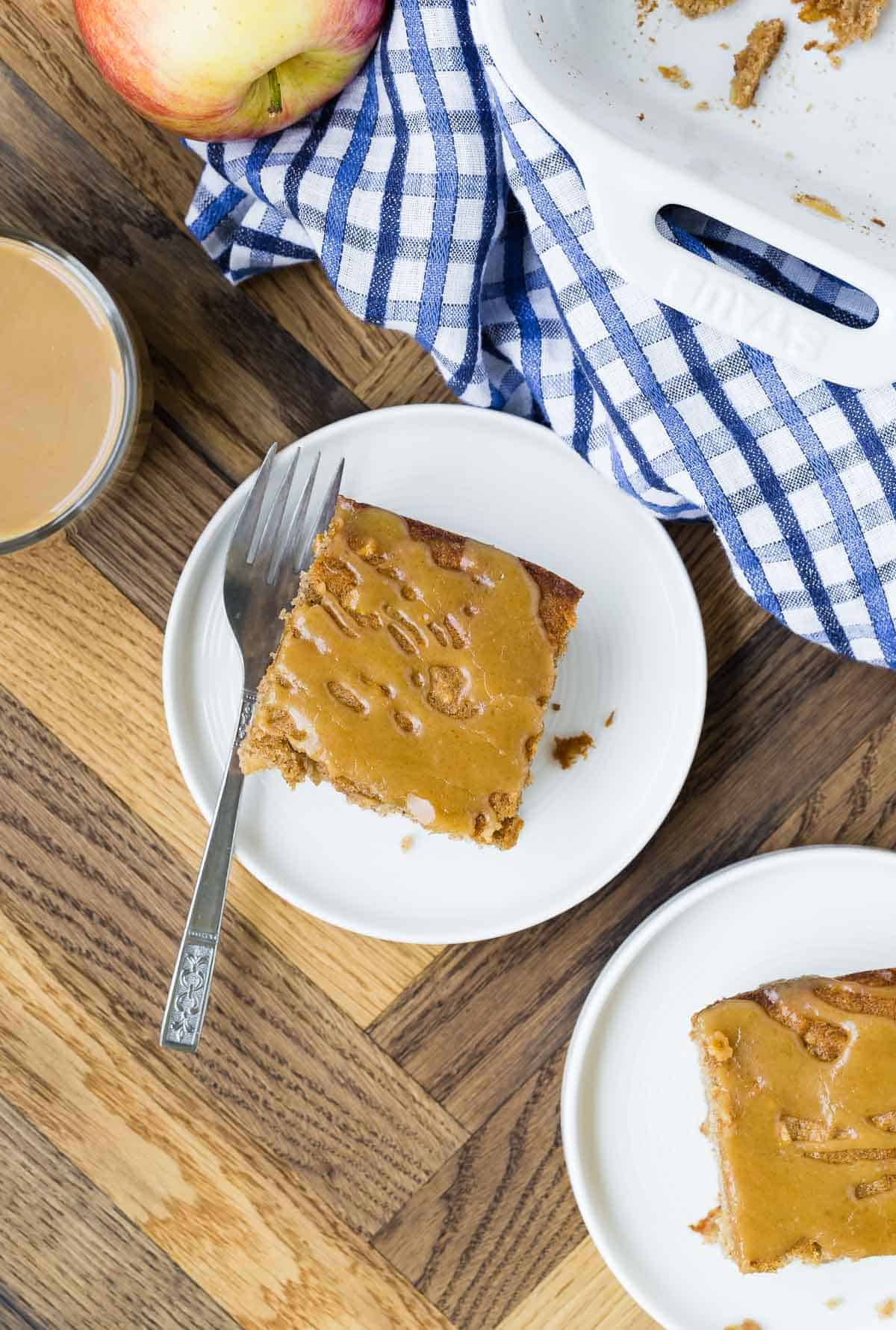 Overhead view of apple cake on plates. 