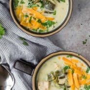 Overhead view of two bowls of soup, text overlay reads "chile relleno soup."