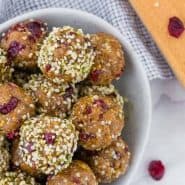 Overhead view of energy balls with cranberries and hemp seeds.