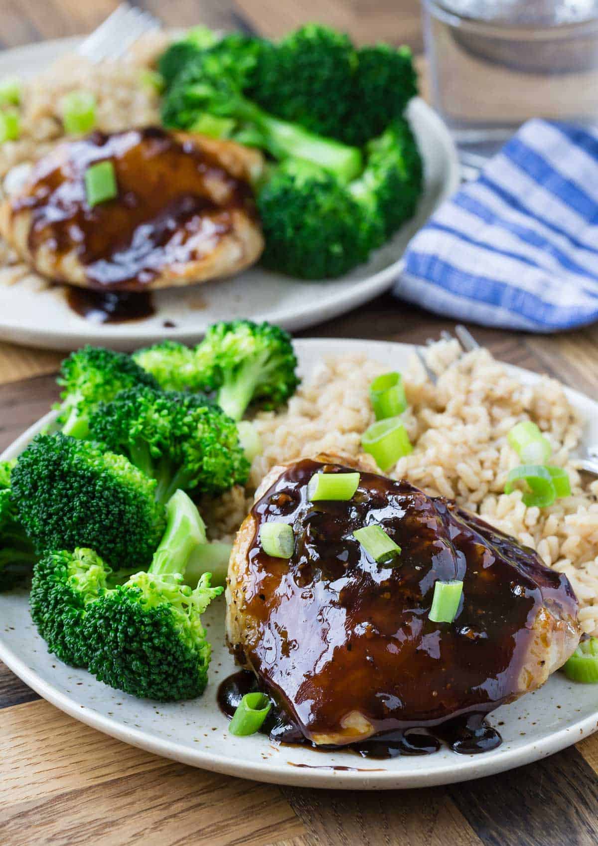 Shiny balsamic glazed chicken with broccoli and rice.