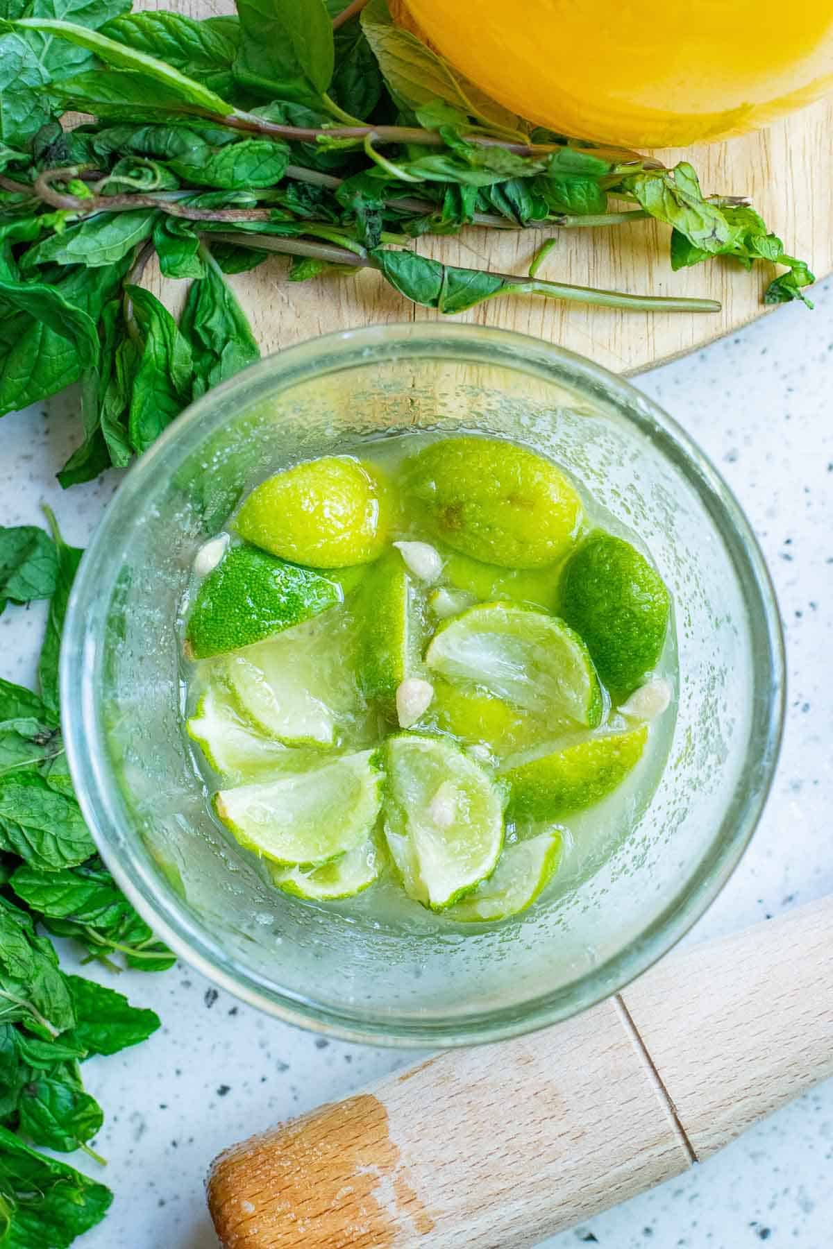 Muddled lime wedges.