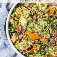 Colorful salad in a white bowl, text overlay reads "vegan quinoa salad with brussels sprouts"