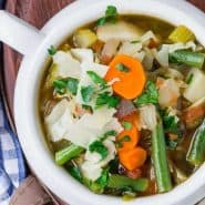 Vegetable soup in a white bowl.