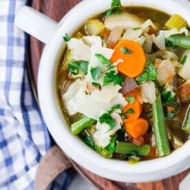 Overhead view of a bowl of color homemade vegetable soup.