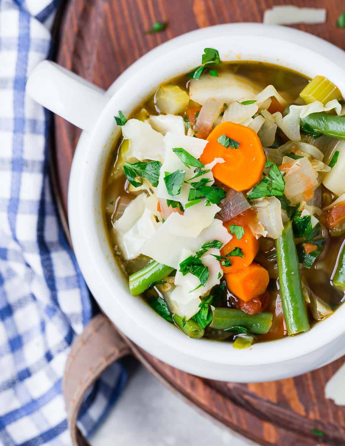 Overhead view of a bowl of color homemade vegetable soup.