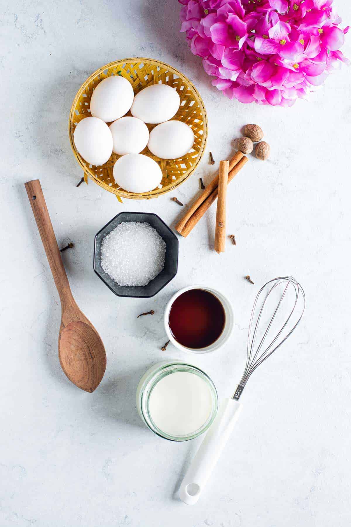 Overhead view of ingredients needed to make eggnog.