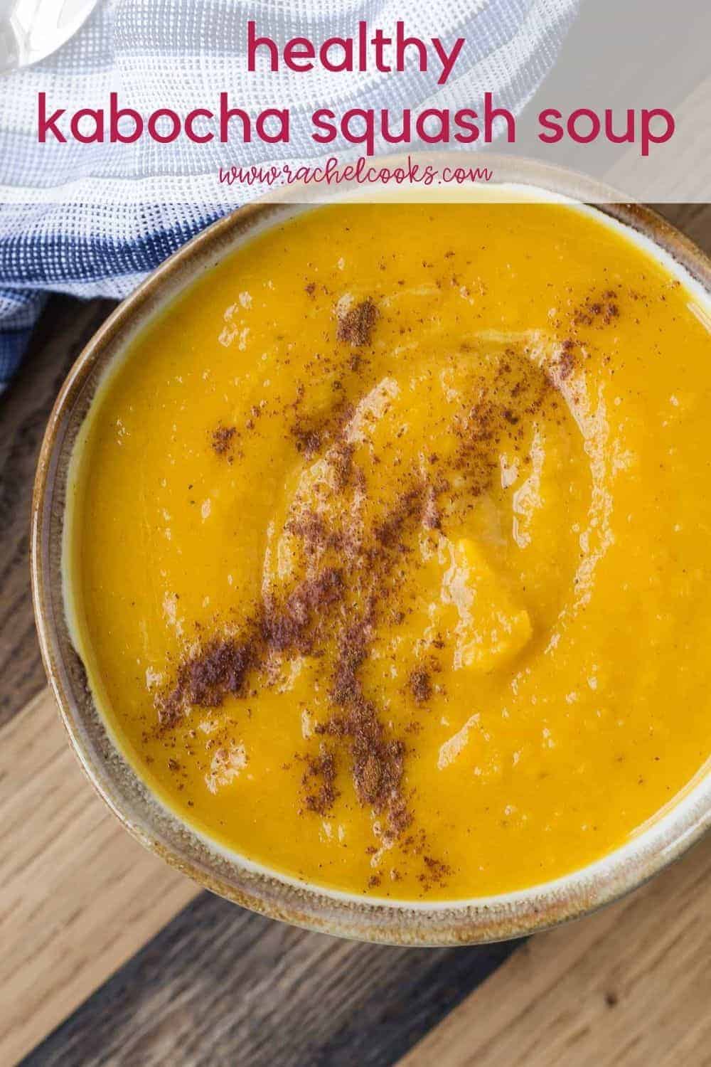 Bowl of orange colored soup, text overlay reads "healthy kabocha squash soup"