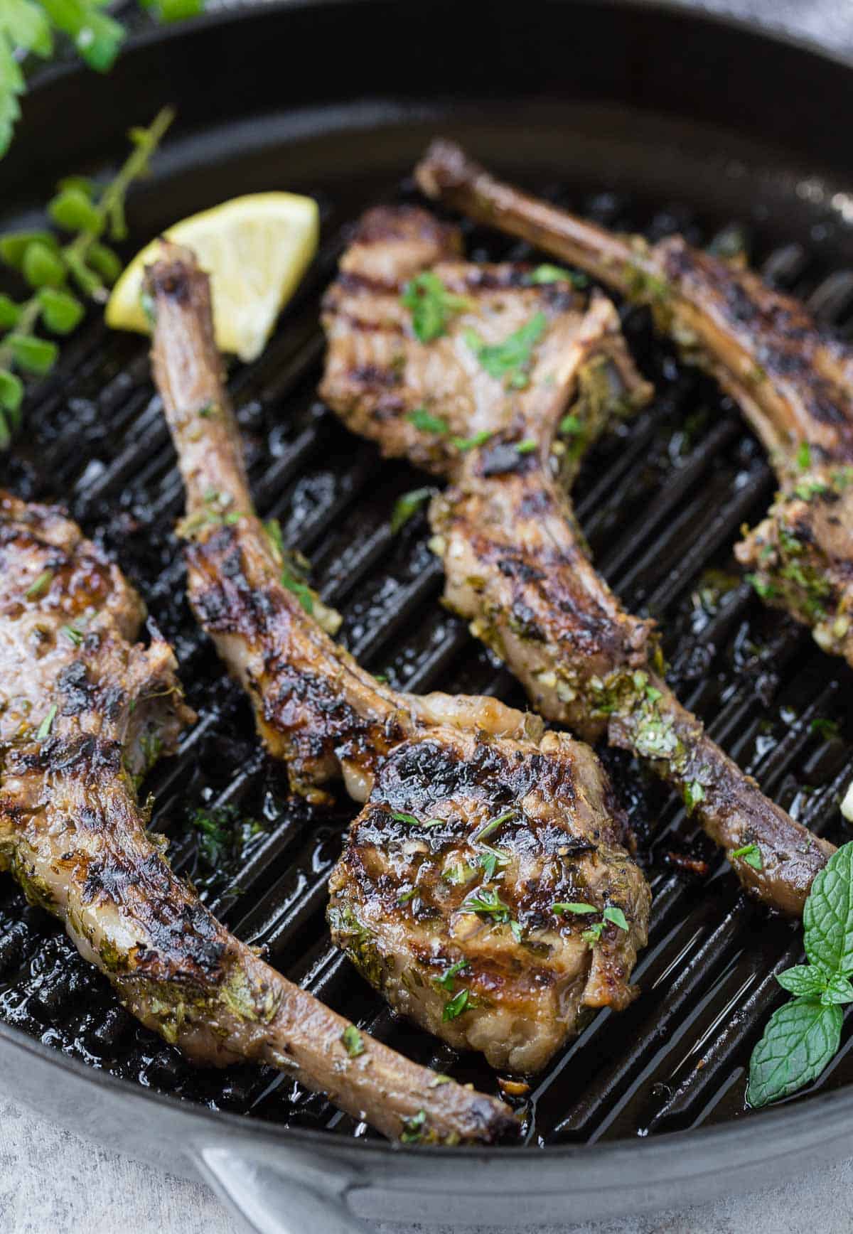 Grilled lamb chops on a pan.