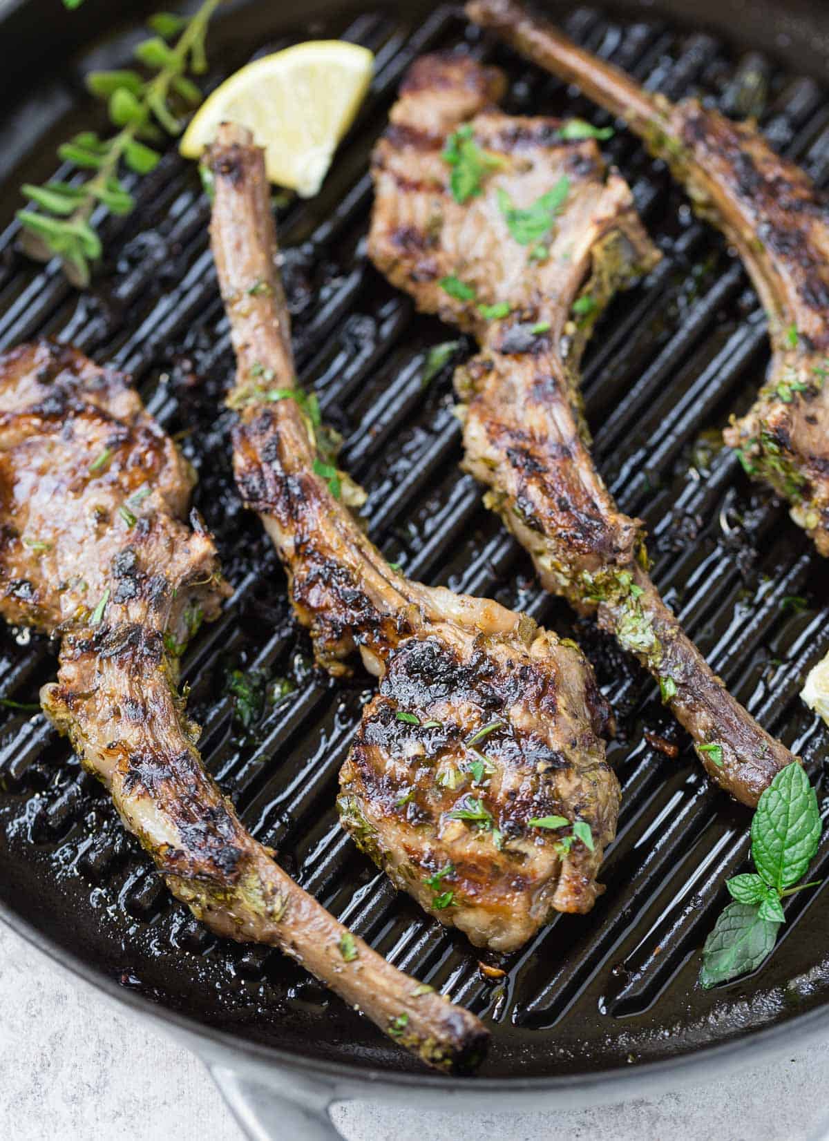 Herb marinated lamb chops on a grill pan.