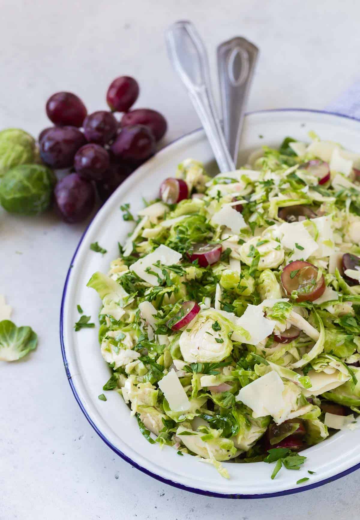 Shredded brussels sprouts salad with red grapes