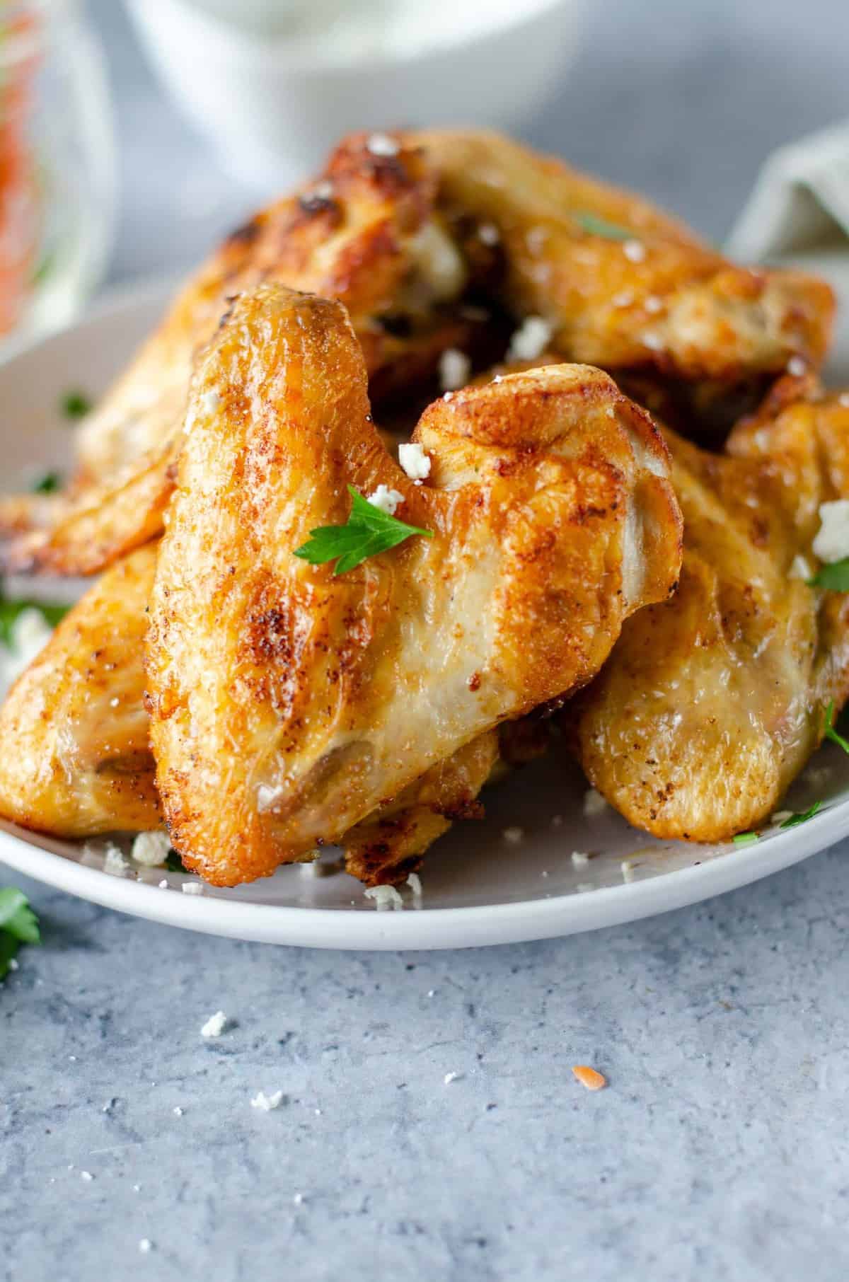 Close up of a crispy chicken wing.