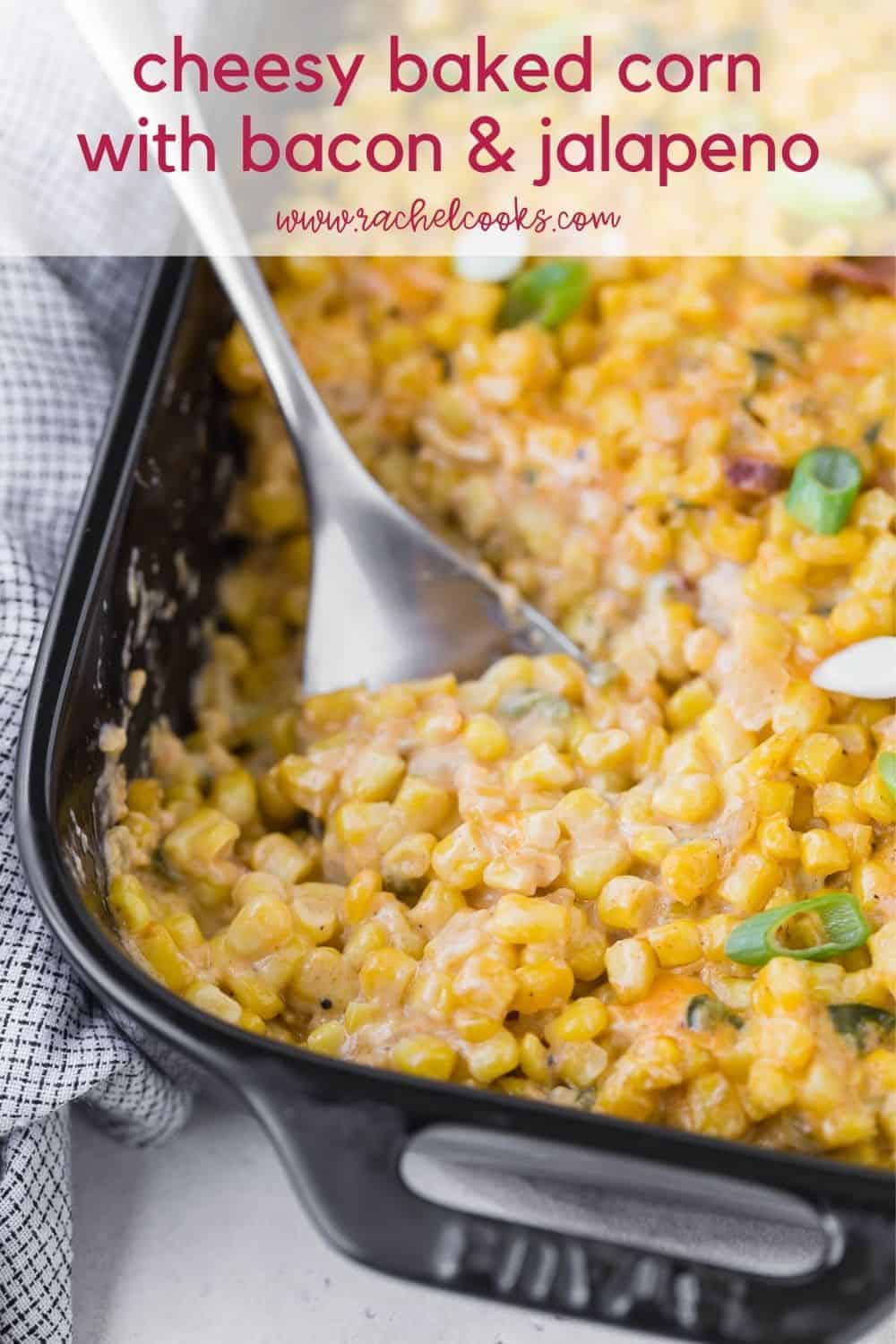 Creamy cheesy corn in a black casserole dish with a text overlay containing the recipe title.