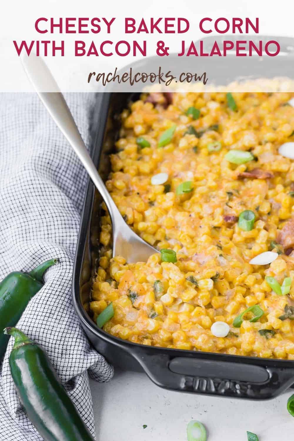 Creamy cheesy corn in a black casserole dish with a text overlay containing the recipe title.