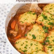 Overhead view of chicken with dumplings, text overlay reads "one pan chicken with cornmeal dumplings"