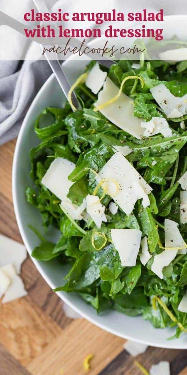 Overhead view of an arugula salad with a text overlay that reads "the best classic arugula salad, rachelcooks.com"