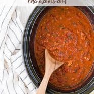 Crockpot full of spaghetti sauce, text overlay reads "the best slow cooker spaghetti sauce"