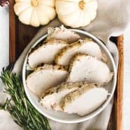 Sliced turkey, with a text overlay that reads "instant pot turkey breast - from frozen!"