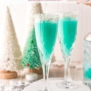 Two bright blue drinks with coconut rims, text overlay reads "jack frost mimosas, rachelcooks.com"