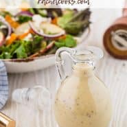 Dressing in glass bottle, salad in background. Text overlay reads "healthy and creamy maple black pepper salad dressing"