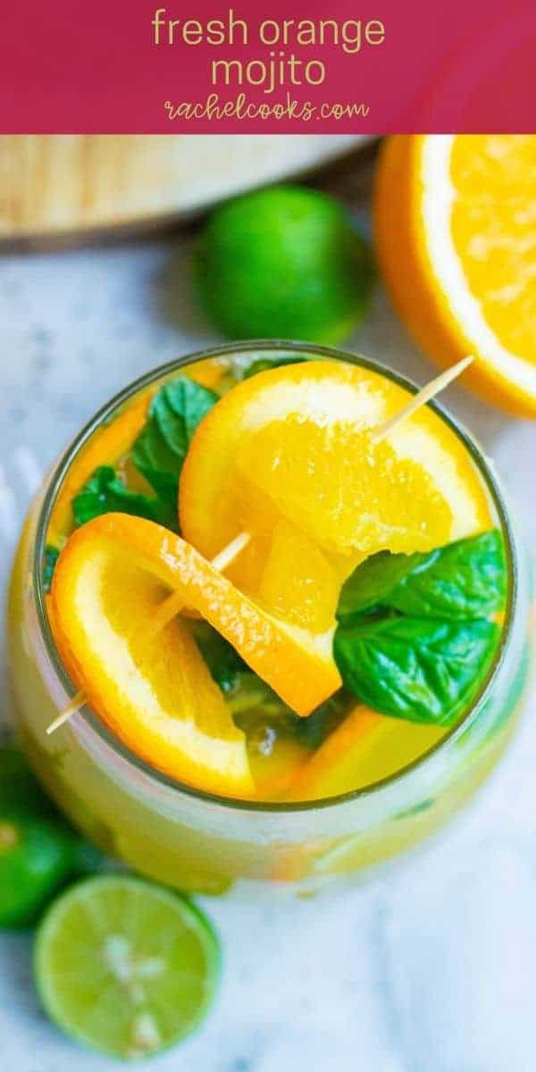 Bright orange cocktail with mint leaves, text overlay reads "orange mojito recipe, rachelcooks.com"