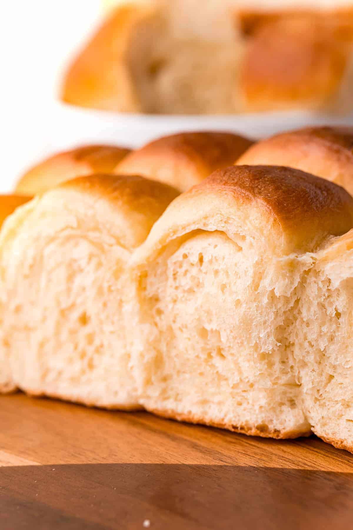 Dinner rolls on a wooden surface.