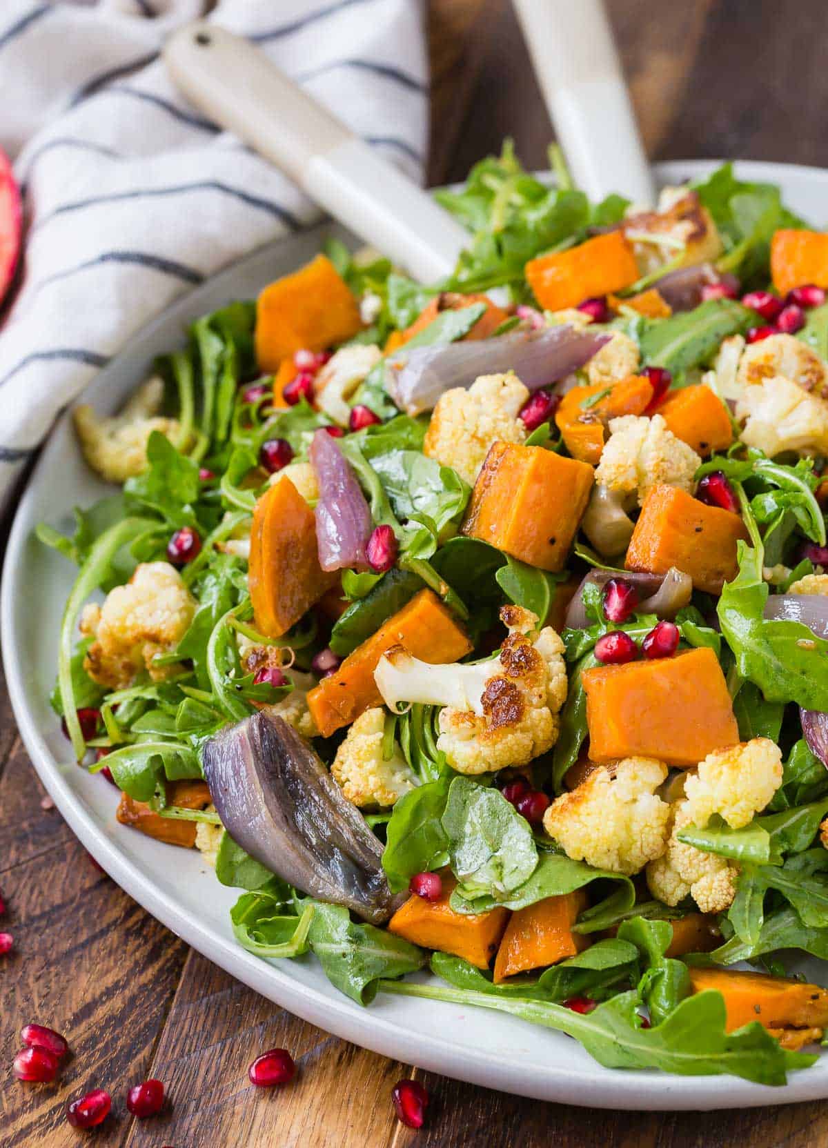 Salad with roasted cauliflower, pomegranate arils, and sweet potatoes.