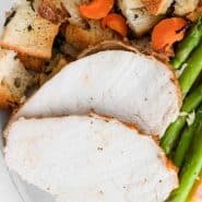 Plated turkey dinner, text overlay reads "sheet pan thanksgiving dinner"