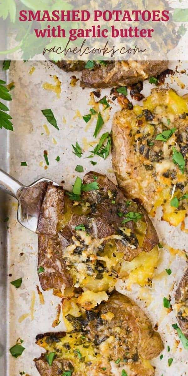 Potatoes on a sheet pan, text overlay reads "smashed potatoes with garlic butter"