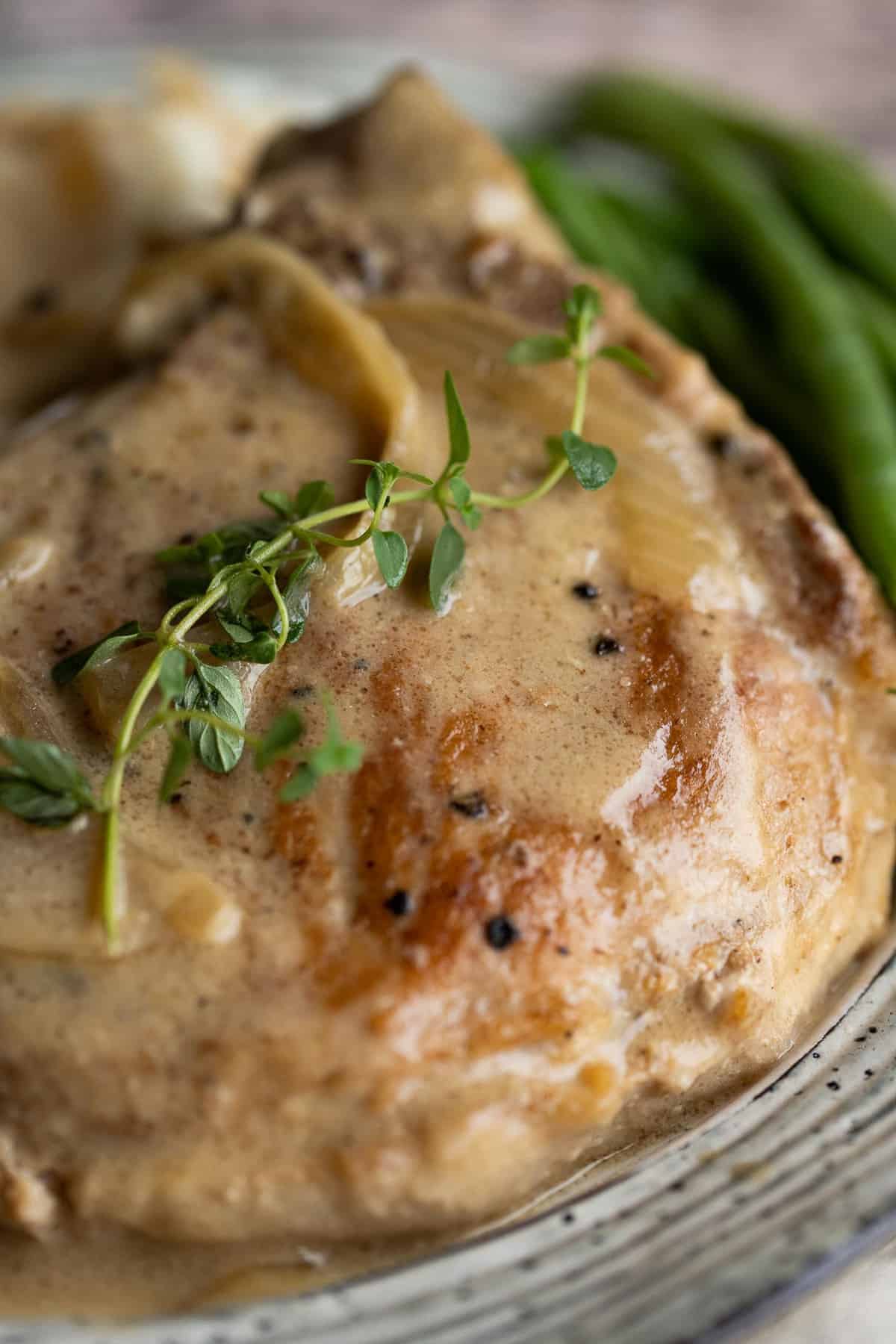 Close up of smothered pork chop.