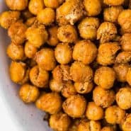 Chickpeas in a bowl, text overlay reads "air fryer crispy chickpeas, rachelcooks.com"