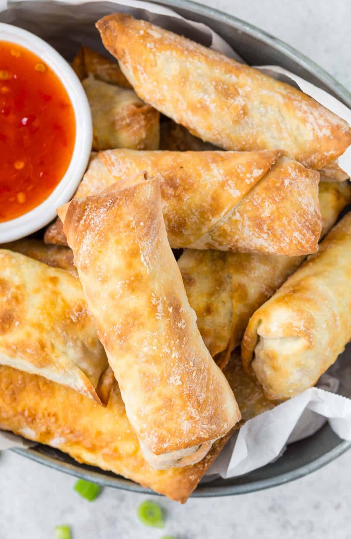 Close up overhead view of golden brown egg rolls.