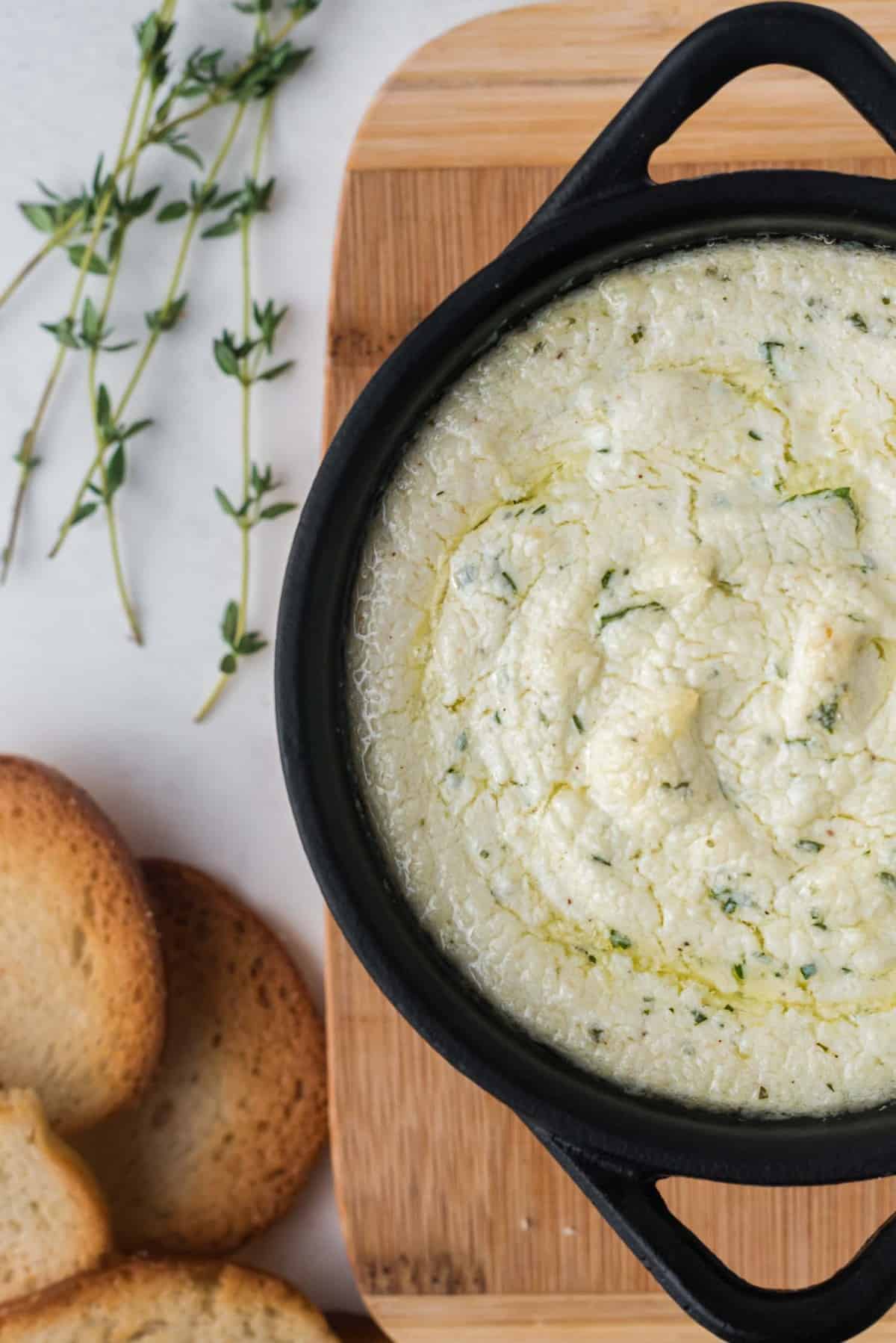 Goat cheese spread after it has been baked.