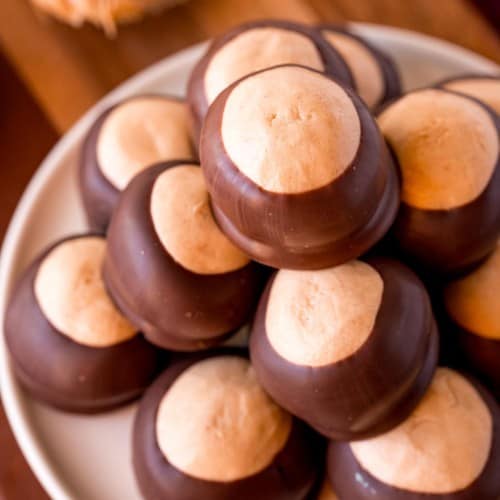 Close up view of buckeye candies made with peanut butter and dipped in chocolate.