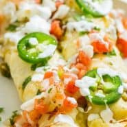 Enchiladas with toppings, text overlay reads "the easiest chicken enchiladas verde, rachelcooks.com"