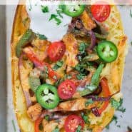 Colorfully topped spaghetti squash half, text overlay reads "chicken fajita stuffed spaghetti squash, rachelcooks.com"