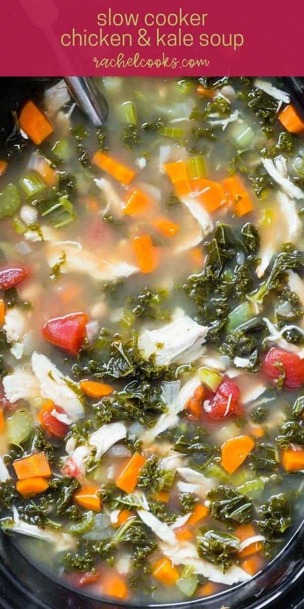 Colorful soup in a black slow cooker, text overlay reads "crockpot chicken and kale soup, rachelcooks.com"