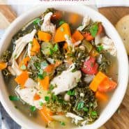 Colorful soup in a bowl, text overlay reads "slow cooker chicken and kale soup, rachelcooks.com"