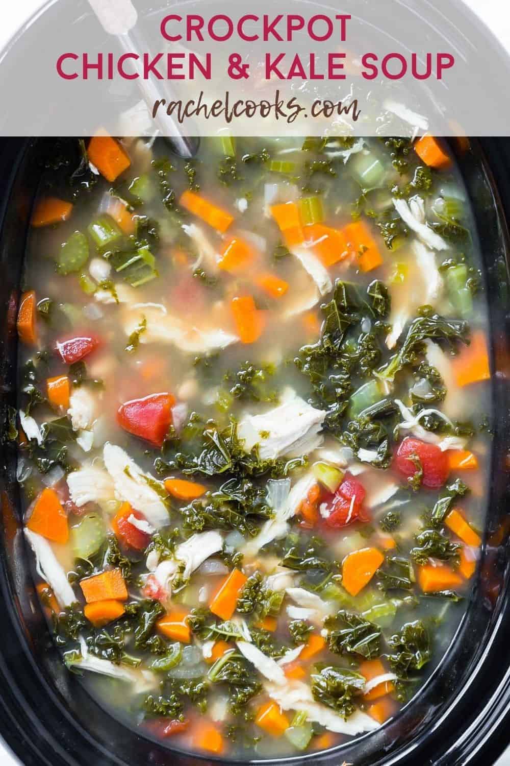 Colorful soup in a black slow cooker, text overlay reads "crockpot chicken and kale soup, rachelcooks.com"