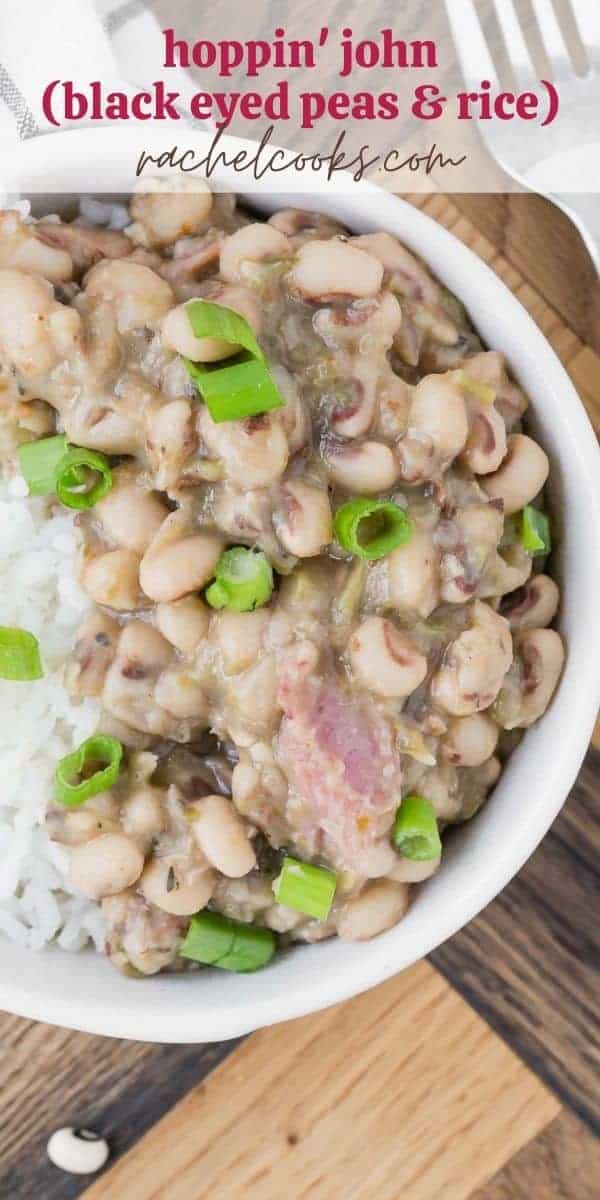 Beans, rice, and ham topped with green onions in small white bowls. Text overlay reads "hoppin' john (black eyed peas & rice), rachelcooks.com"