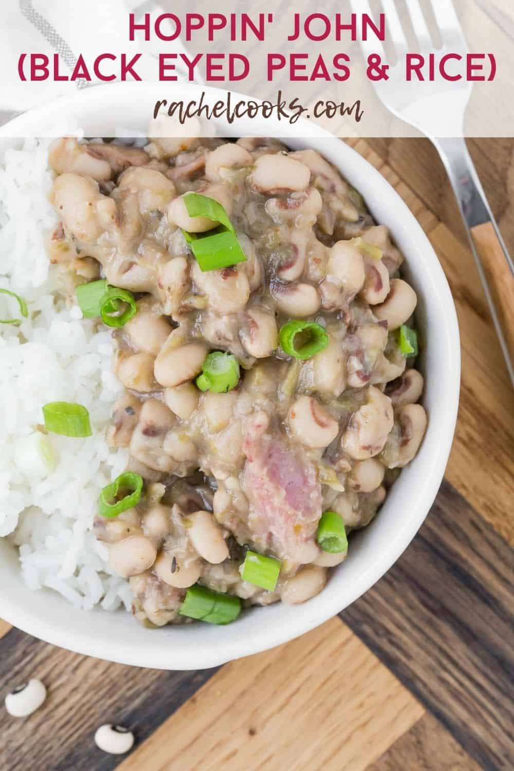 Beans, rice, and ham topped with green onions in small white bowls. Text overlay reads "hoppin' john (black eyed peas & rice), rachelcooks.com"