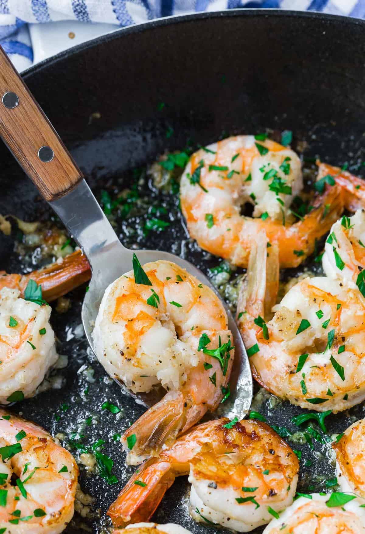 Shrimp on a serving spoon.