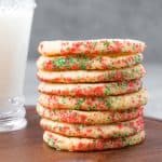 Stack of sand tartsugar cookies with red and green sugar.