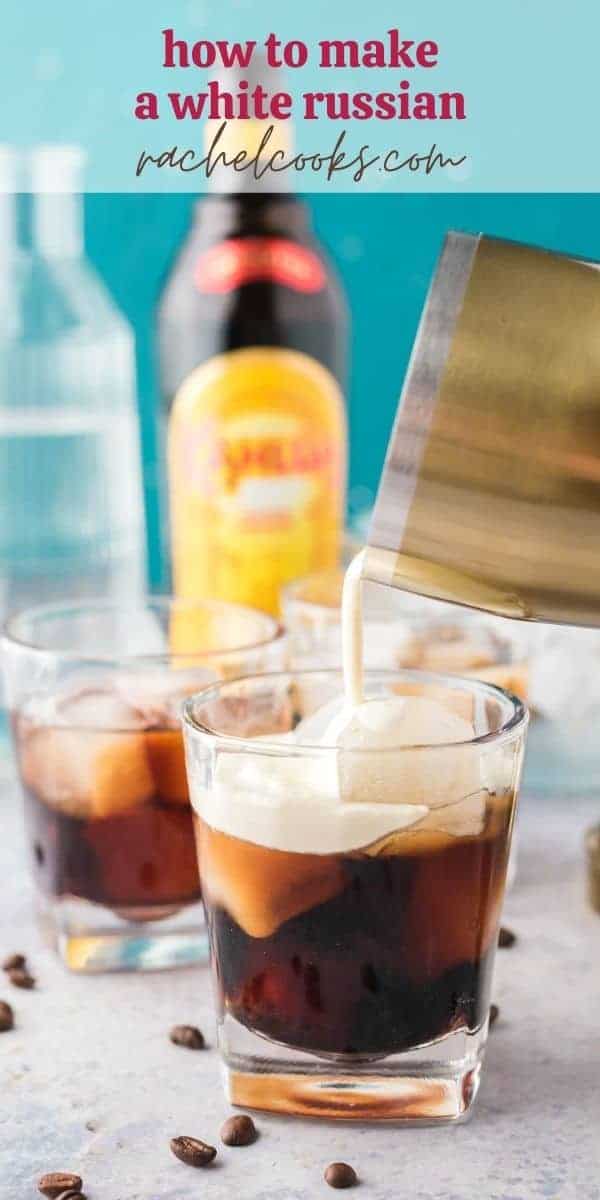 A short clear glass with a dark brown liquid, and heavy cream being poured in. Text overlay reads "how to make a white russian, rachelcooks.com"