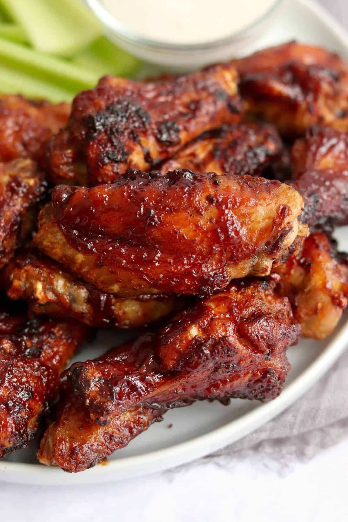 Air fried chicken wings coated in bbq sauce.