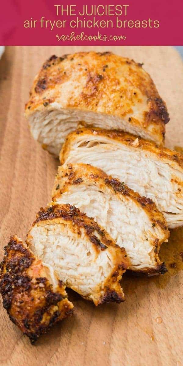 Cut chicken on a cutting board, text overlay reads "air fryer chicken breasts, rachelcooks.com"