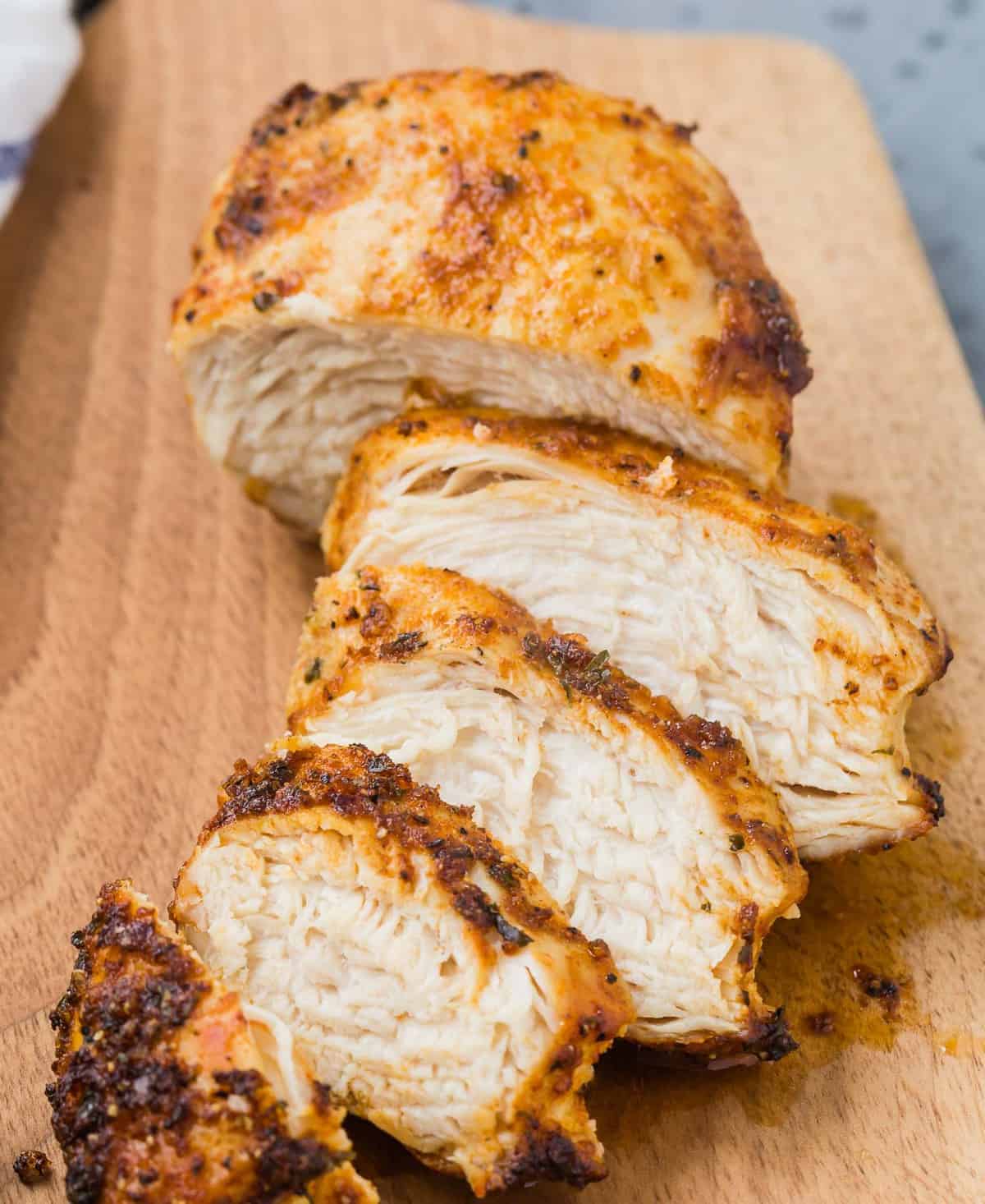Close up of sliced cooked chicken.