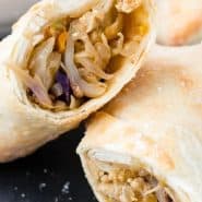 Cut open egg roll, text overlay reads "air fryer egg rolls, rachelcooks.com"