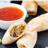 Cut open egg roll, text overlay reads "air fryer egg rolls, rachelcooks.com"