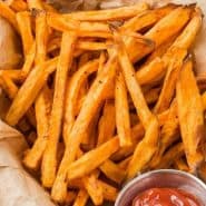 Overhead view of fries, text overlay reads "air fryer sweet potato fries, rachelcooks.com"